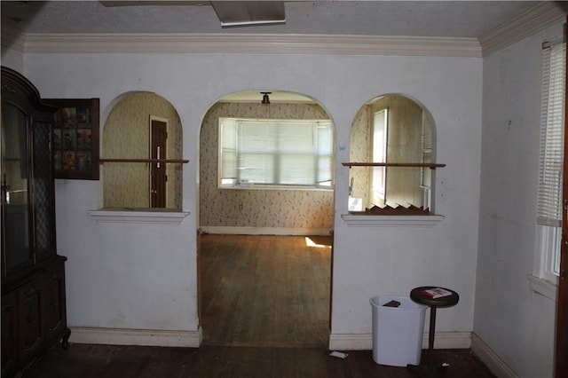 717 E Jefferson Park, Jefferson, LA 70121 - unfurnished dining area with wood finished floors, baseboards, and crown molding