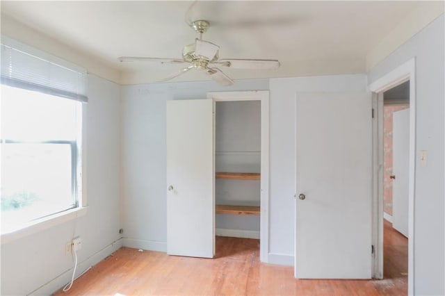 717 E Jefferson Park, Jefferson, LA 70121 - unfurnished bedroom featuring light wood-style flooring, a walk in closet, a closet, and a ceiling fan