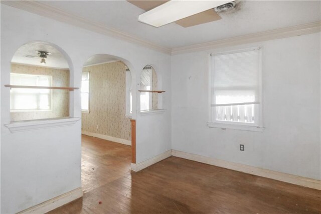 717 E Jefferson Park, Jefferson, LA 70121 - spare room featuring wood finished floors, crown molding, and arched walkways