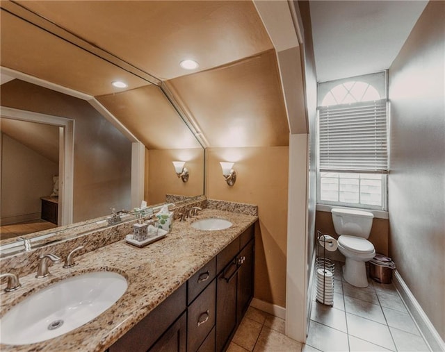 723 Kerlerec St, New Orleans, LA 70116 - full bath featuring lofted ceiling, double vanity, plenty of natural light, and tile patterned floors