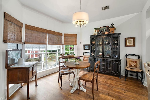 612 E 4th Ave, Covington, LA 70433 - dining space with a chandelier and wood finished floors