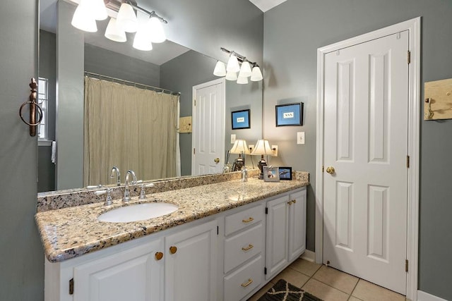 612 E 4th Ave, Covington, LA 70433 - bathroom with tile patterned flooring and double vanity