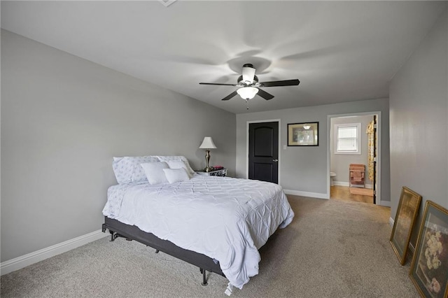 285 8th Street Dr, Ponchatoula, LA 70454 - carpeted bedroom featuring baseboards, ceiling fan, and ensuite bath
