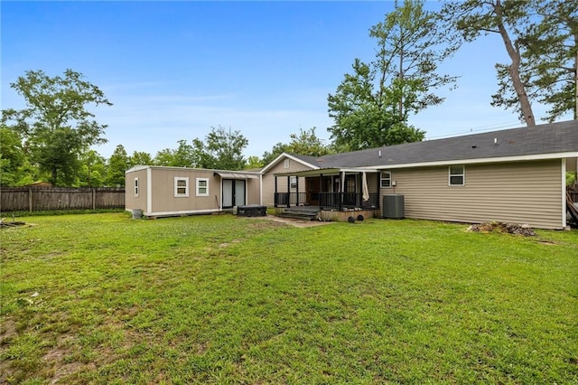285 8th Street Dr, Ponchatoula, LA 70454 - rear view of house featuring central AC and a deck