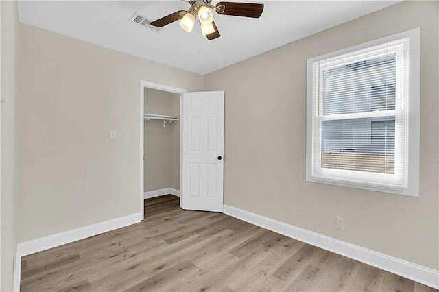 6073 Wickfield Dr, New Orleans, LA 70122 - unfurnished bedroom featuring light wood-style flooring, baseboards, a closet, and ceiling fan
