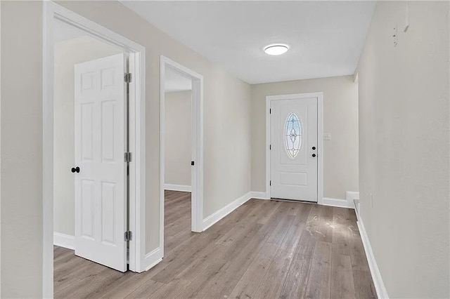 6073 Wickfield Dr, New Orleans, LA 70122 - entryway featuring wood finished floors and baseboards