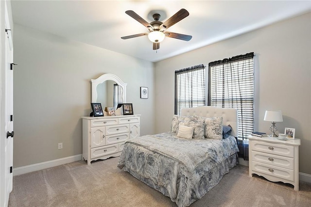 6476 Nesting Dr, Gonzales, LA 70737 - bedroom featuring multiple windows, light carpet, baseboards, and a ceiling fan