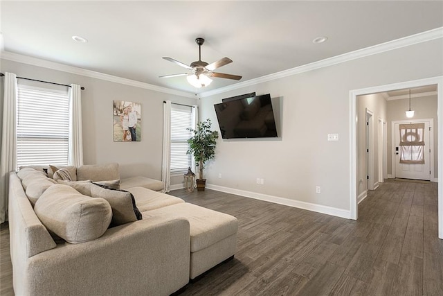 6476 Nesting Dr, Gonzales, LA 70737 - living room featuring a ceiling fan, dark wood-style flooring, baseboards, and crown molding