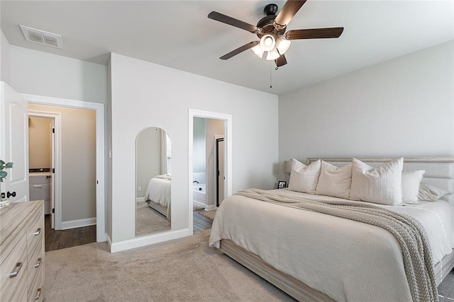 6476 Nesting Dr, Gonzales, LA 70737 - bedroom featuring light colored carpet, baseboards, a ceiling fan, and ensuite bathroom