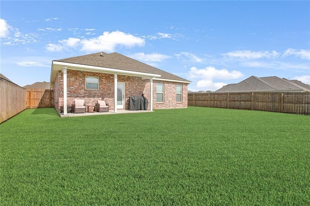6476 Nesting Dr, Gonzales, LA 70737 - rear view of house with brick siding and a patio area