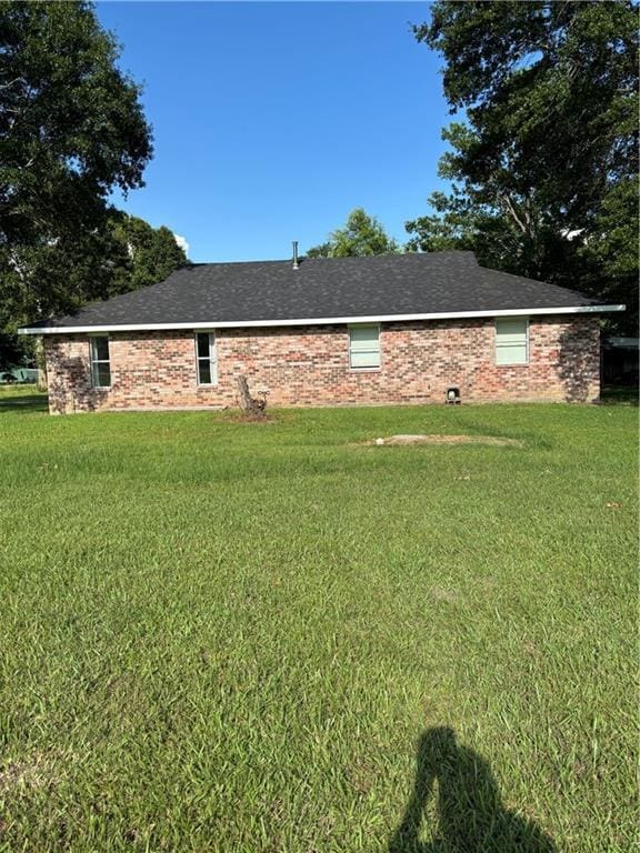 11036 Gulino Rd, Amite, LA 70422 - view of home's exterior with a lawn
