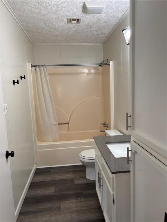 11036 Gulino Rd, Amite, LA 70422 - bathroom with a textured ceiling, shower / bathtub combination with curtain, ornamental molding, vanity, and wood finished floors
