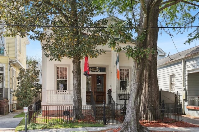 1212 Milan St, New Orleans, LA 70115 - view of front of house featuring covered porch, a fenced front yard, and a gate
