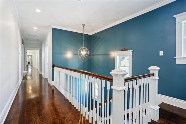 1212 Milan St, New Orleans, LA 70115 - corridor with an upstairs landing, wood finished floors, crown molding, baseboards, and a chandelier