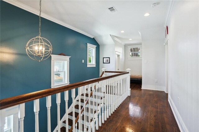 1212 Milan St, New Orleans, LA 70115 - corridor featuring a chandelier, wood finished floors, baseboards, crown molding, and recessed lighting