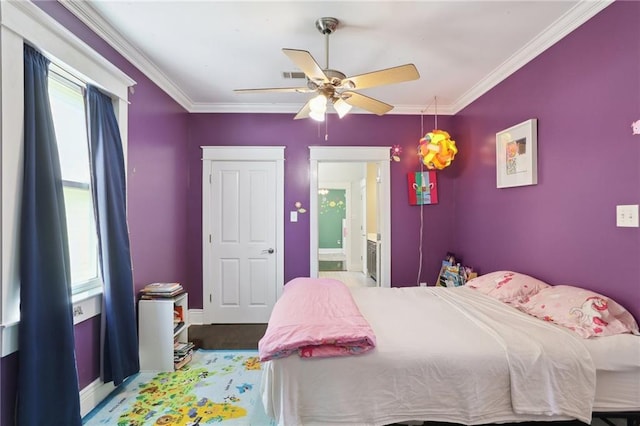 1212 Milan St, New Orleans, LA 70115 - bedroom featuring multiple windows, crown molding, ensuite bath, a ceiling fan, and baseboards