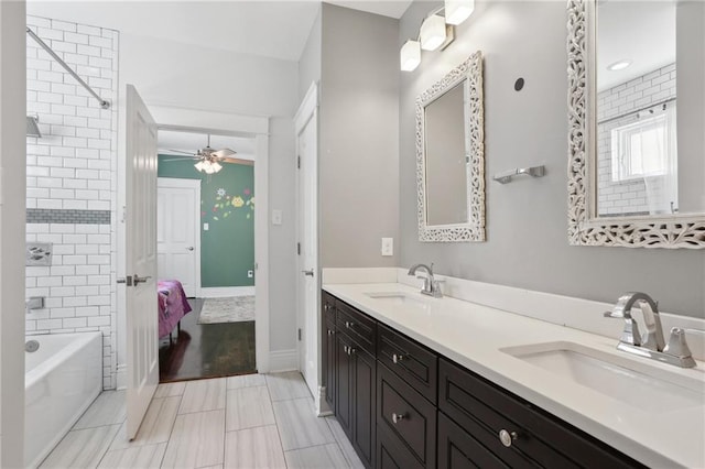 1212 Milan St, New Orleans, LA 70115 - ensuite bathroom with double vanity, bathtub / shower combination, and ceiling fan
