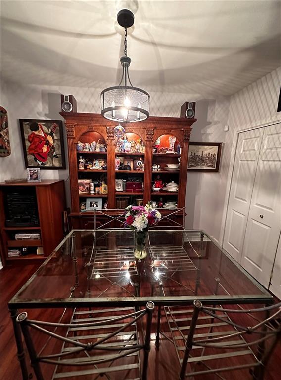 3514 Audubon Trce Unit 3514, Jefferson, LA 70121 - bar featuring dark wood-style flooring and decorative light fixtures