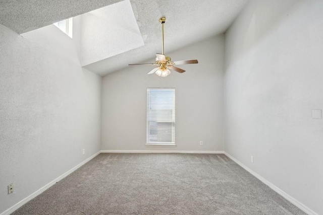 4218 Hessmer Ave Unit 309, Metairie, LA 70002 - carpeted empty room featuring a ceiling fan, lofted ceiling, a textured ceiling, and baseboards