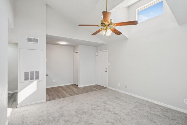 4218 Hessmer Ave Unit 309, Metairie, LA 70002 - unfurnished room featuring carpet floors, high vaulted ceiling, and a ceiling fan