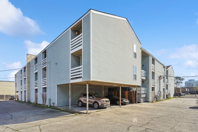 4218 Hessmer Ave Unit 309, Metairie, LA 70002 - view of building exterior with covered parking