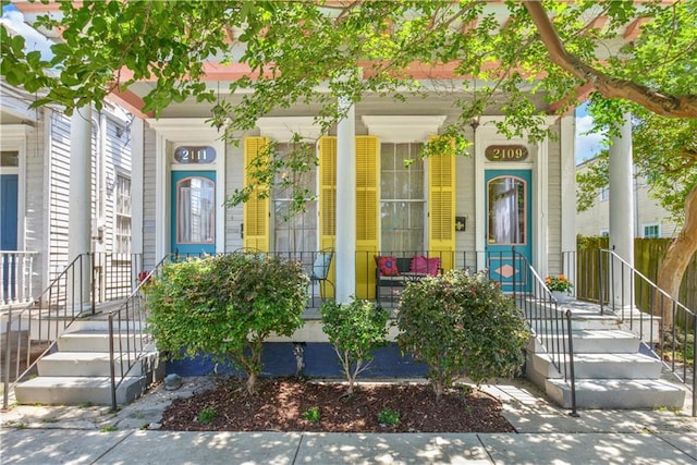 210911 Josephine St, New Orleans, LA 70113 - entrance to property featuring a porch