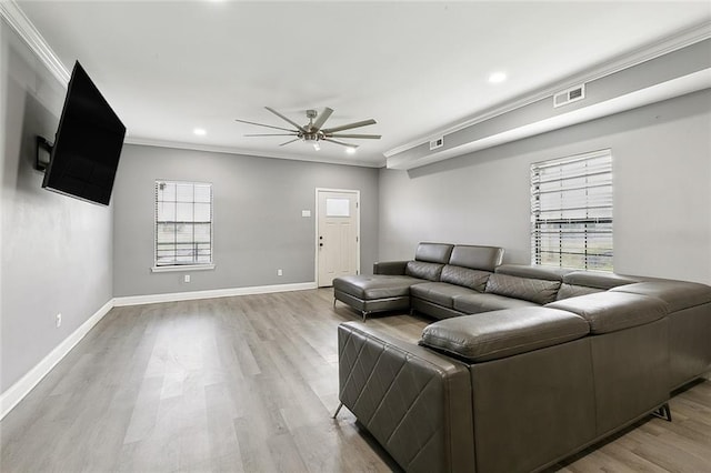263638 Flood St, New Orleans, LA 70117 - living area featuring ceiling fan, healthy amount of natural light, light wood-style flooring, ornamental molding, and recessed lighting