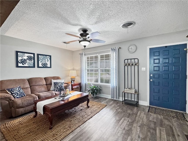 121 Matthews Dr, Slidell, LA 70458 - living area featuring a ceiling fan, wood finished floors, baseboards, and a textured ceiling