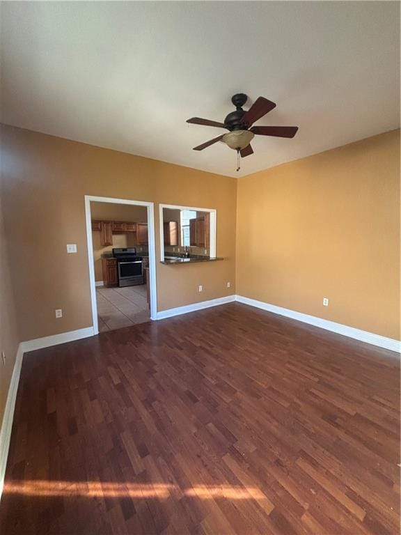 2428 Hamilton St, New Orleans, LA 70118 - empty room featuring wood finished floors, ceiling fan, and baseboards