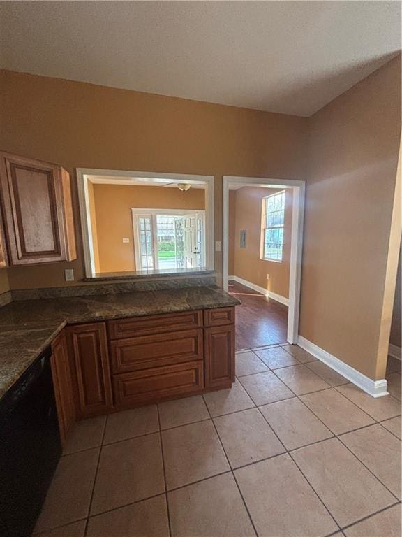 2428 Hamilton St, New Orleans, LA 70118 - bathroom featuring plenty of natural light, tile patterned floors, and baseboards
