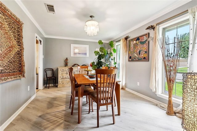 5238 Macarthur Blvd, New Orleans, LA 70131 - dining space featuring plenty of natural light, ornamental molding, and light wood-style flooring
