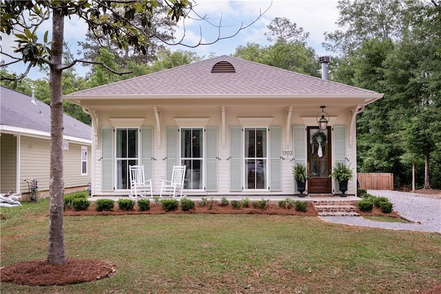 1302 W 23rd Ave, Covington, LA 70433 - view of front of property featuring a porch, a front lawn, and roof with shingles