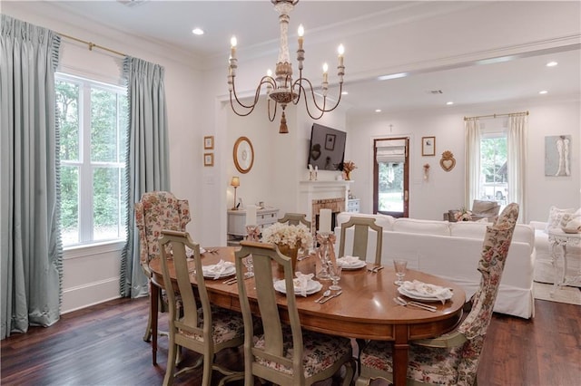 1302 W 23rd Ave, Covington, LA 70433 - dining space featuring healthy amount of natural light, dark wood-style floors, a chandelier, ornamental molding, and recessed lighting