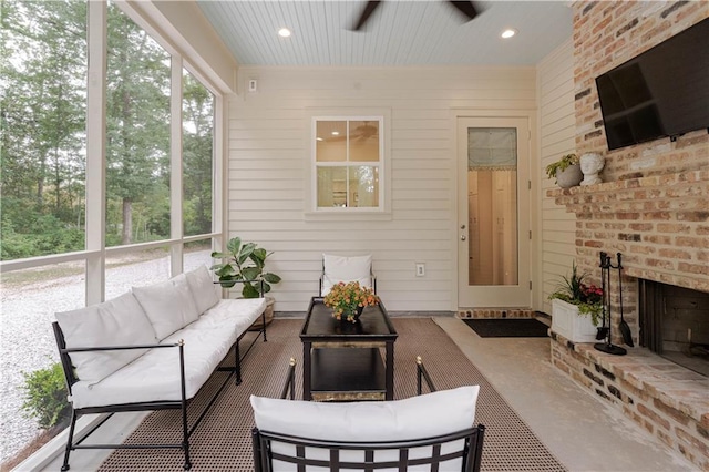 1302 W 23rd Ave, Covington, LA 70433 - sunroom featuring an outdoor living space with a fireplace and a ceiling fan