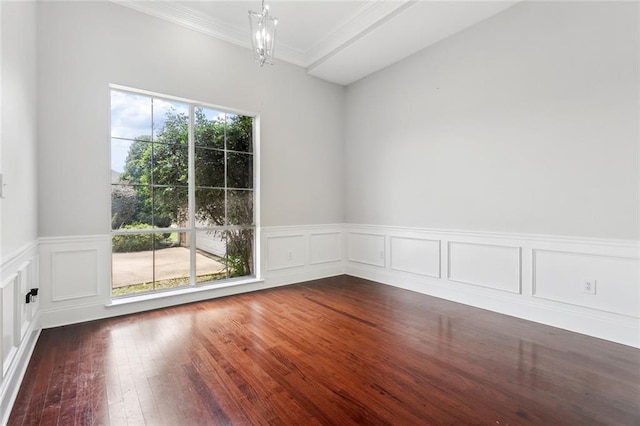 322 Palermo Dr, Slidell, LA 70458 - empty room featuring crown molding, wainscoting, dark wood-style flooring, and a decorative wall