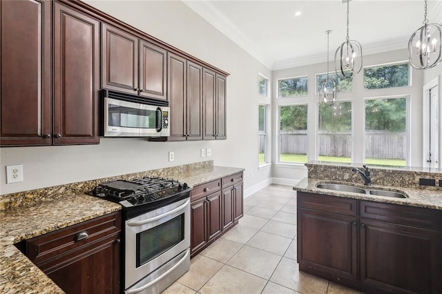 322 Palermo Dr, Slidell, LA 70458 - kitchen featuring stainless steel appliances, ornamental molding, light stone countertops, healthy amount of natural light, and hanging light fixtures