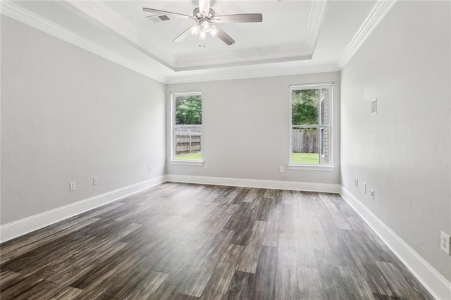 322 Palermo Dr, Slidell, LA 70458 - unfurnished room with a raised ceiling, healthy amount of natural light, dark wood finished floors, ceiling fan, and crown molding