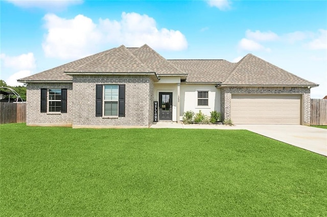 19499 Deerfield Loop, Loranger, LA 70446 - view of front of home featuring a garage, driveway, brick siding, and roof with shingles