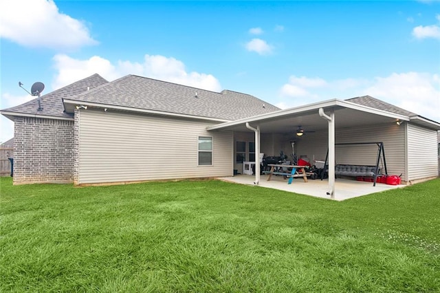 19499 Deerfield Loop, Loranger, LA 70446 - rear view of property featuring a shingled roof, a ceiling fan, a patio area, and a yard