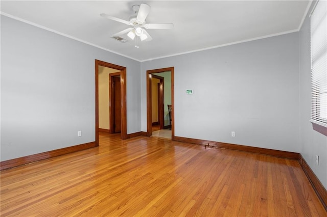 230 Jules Ave, Jefferson, LA 70121 - spare room featuring baseboards, a ceiling fan, light wood-style floors, and crown molding