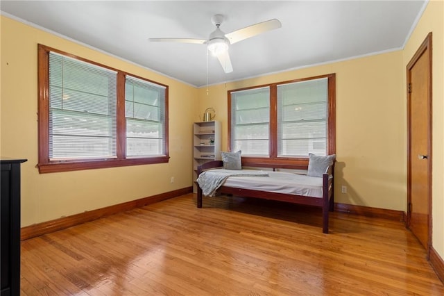 230 Jules Ave, Jefferson, LA 70121 - bedroom with light wood-style flooring, ornamental molding, baseboards, and ceiling fan