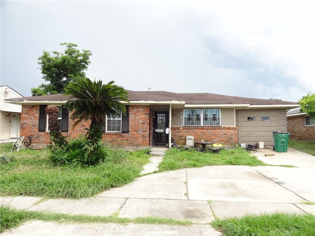 6208 Morton St, Metairie, LA 70003 - ranch-style house featuring brick siding, an attached garage, and concrete driveway