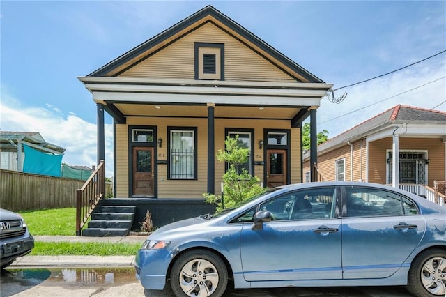 4716-18 Burgundy St, New Orleans, LA 70117 - view of front of property featuring covered porch