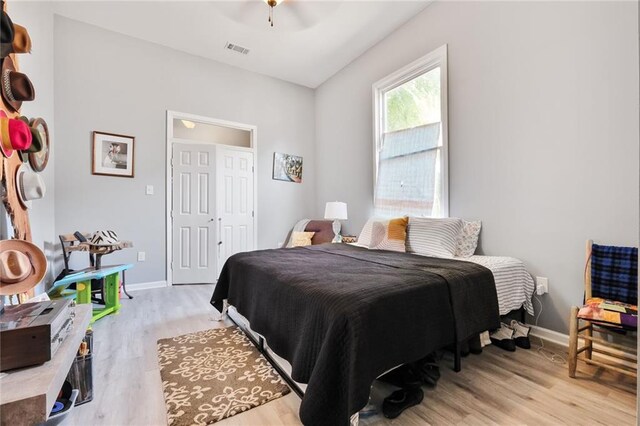 4716-18 Burgundy St, New Orleans, LA 70117 - bedroom featuring light wood-style floors, baseboards, and a ceiling fan