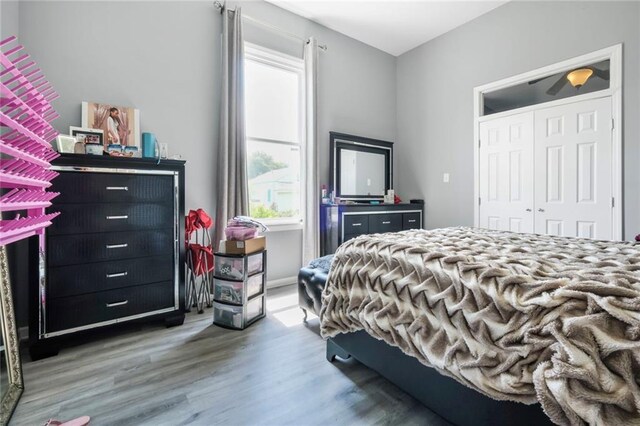 4716-18 Burgundy St, New Orleans, LA 70117 - bedroom featuring multiple windows and wood finished floors