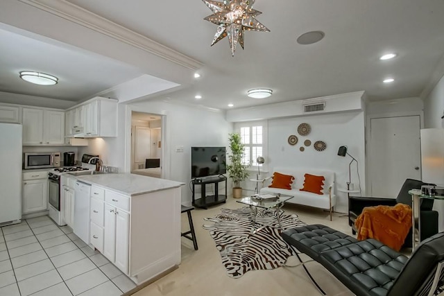 1323 Dauphine St Unit 3, New Orleans, LA 70116 - kitchen with white appliances, crown molding, white cabinetry, a peninsula, and a breakfast bar