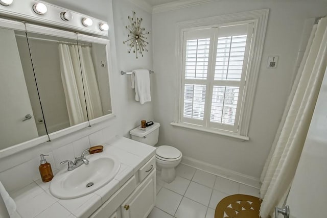 1323 Dauphine St Unit 3, New Orleans, LA 70116 - full bathroom with healthy amount of natural light, vanity, toilet, tile patterned flooring, and ornamental molding