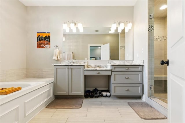 1233 Brockenbraugh Ct, Metairie, LA 70005 - bathroom featuring vanity, a shower stall, and a garden tub