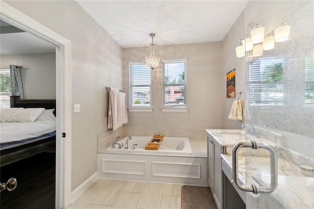 1233 Brockenbraugh Ct, Metairie, LA 70005 - full bath with a chandelier, a bath, vanity, and ensuite bath