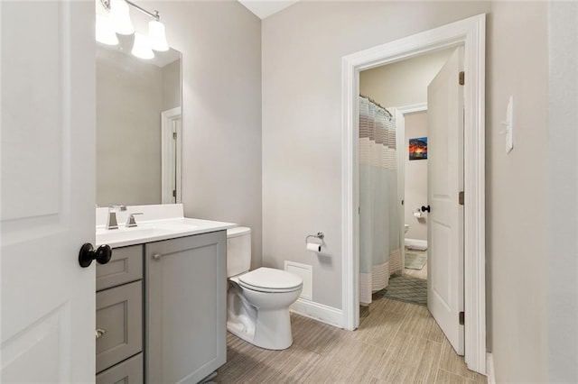 1233 Brockenbraugh Ct, Metairie, LA 70005 - full bathroom featuring vanity, toilet, and baseboards